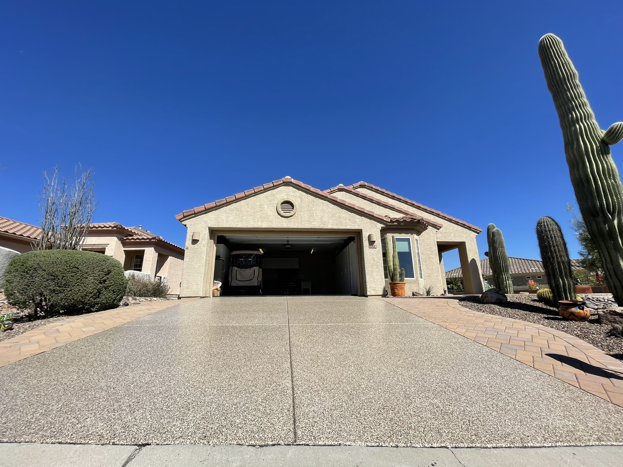 Incredible Epoxy removal and Polyaspartic Driveway concrete coating installation performed in, Marana, AZ